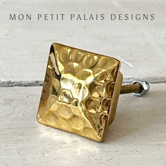 Angled view of Square Hammered Gold Knob with aged gold finish.