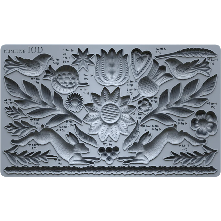 IOD Primitive Decor Mould featuring symmetrical designs with floral and animal motifs for crafting.