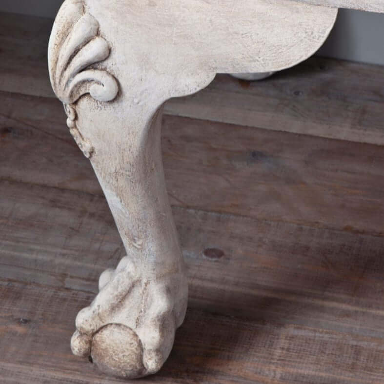 Annie Sloan Dark Chalk Paint™ Wax applied on a vintage furniture leg, highlighting intricate details and textures.