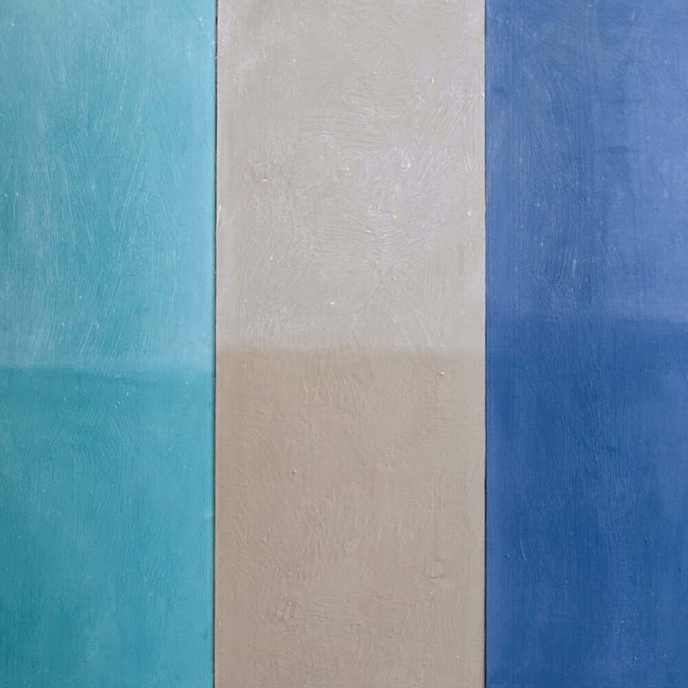 Annie Sloan White Chalk Paint Wax color samples showcasing soft limed finishes in blue, beige, and turquoise.