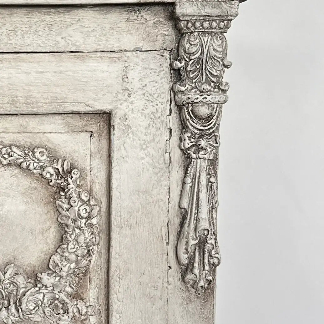 Annie Sloan Dark Chalk Paint™ Wax applied to vintage furniture with ornate detailing and texture.