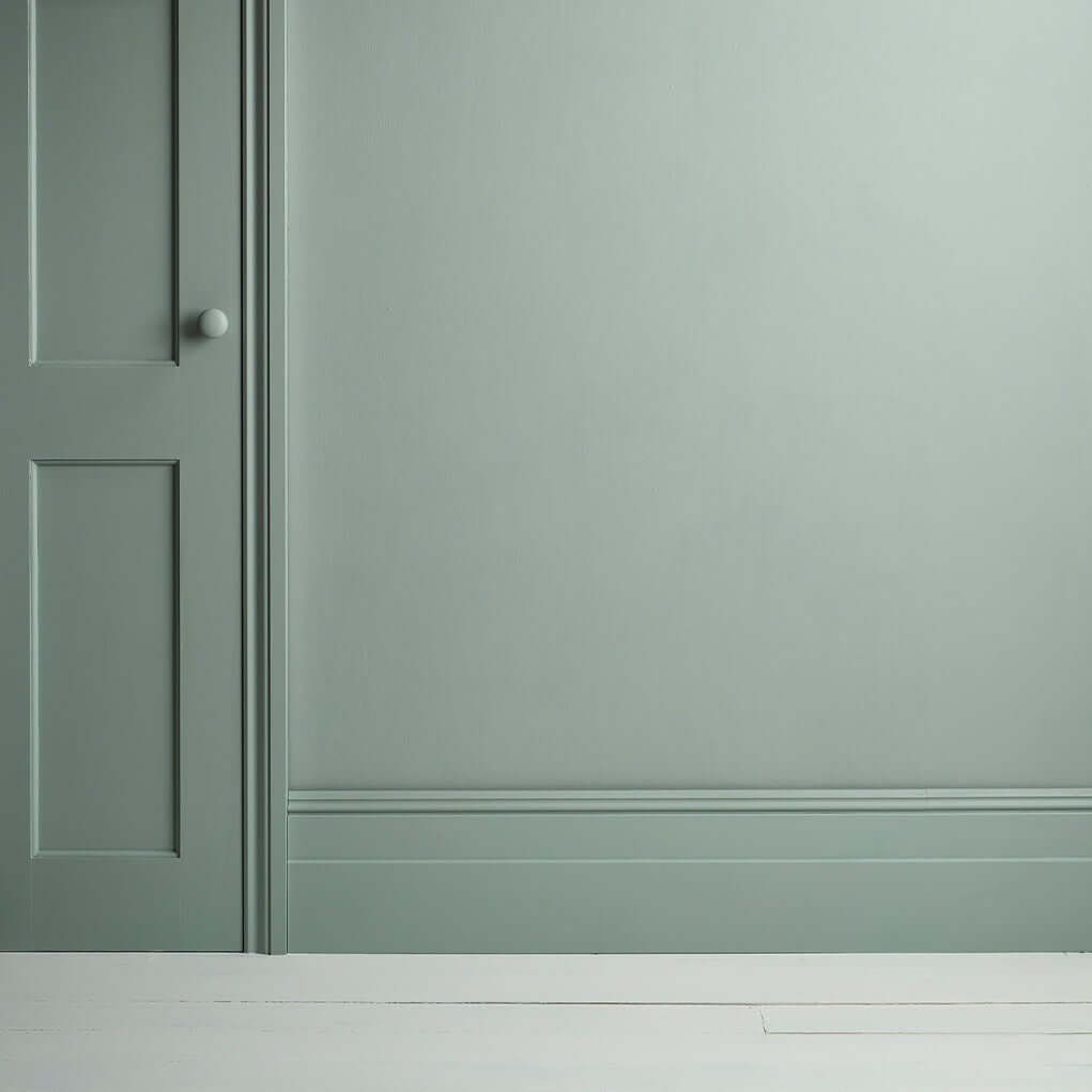 Pemberley Blue - Annie Sloan Satin Paint applied to a wall and door, showcasing a refined pastel blue finish.