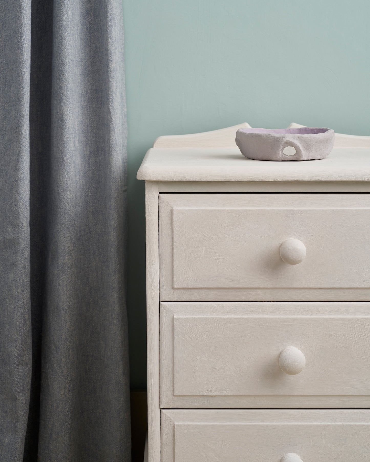Close-up of Rococo White-painted drawers, highlighting its soft pink-white tone.