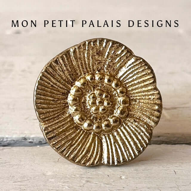 Antique Gold Floral Metal Knob with an embossed flower design, aged gold finish, and vintage-inspired detailing for furniture and cabinetry.