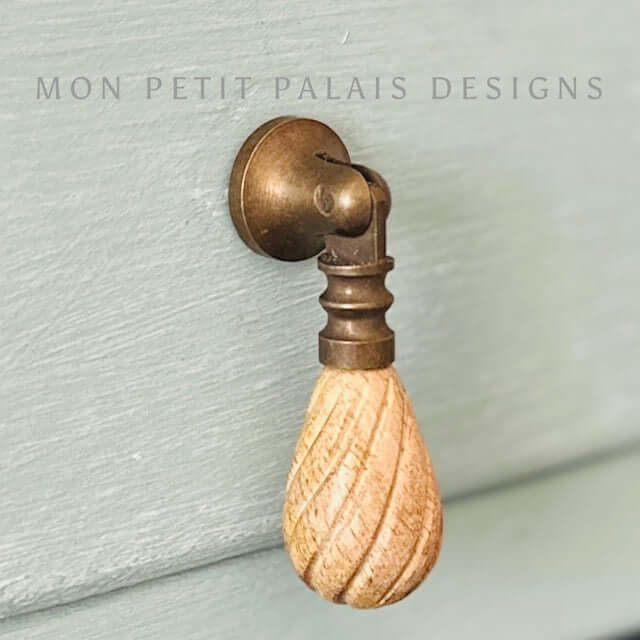 Elodie drop handles with carved wood teardrop and antique brass mount - perfect for French or coastal furniture updates.