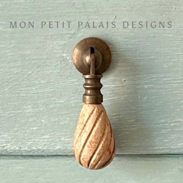 Front view of Elodie drop pull showing spiral carved wood and classic brass fixture - Mon Petit Palais Designs.