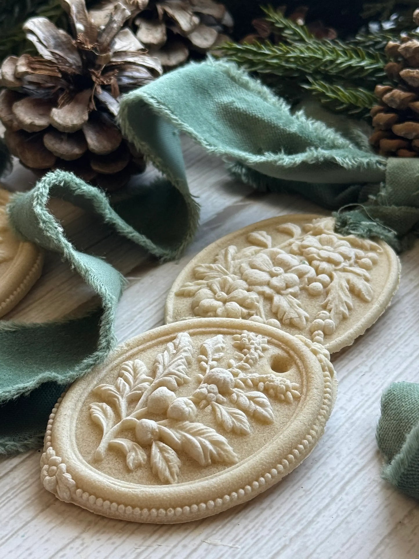IOD Victoriana Decor Mould showcasing intricate floral details against a background of greenery and natural elements.