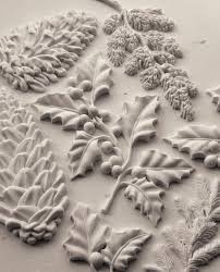 IOD Winter Forage Decor Mould showcasing intricate pinecones, branches, and berries for seasonal decor.