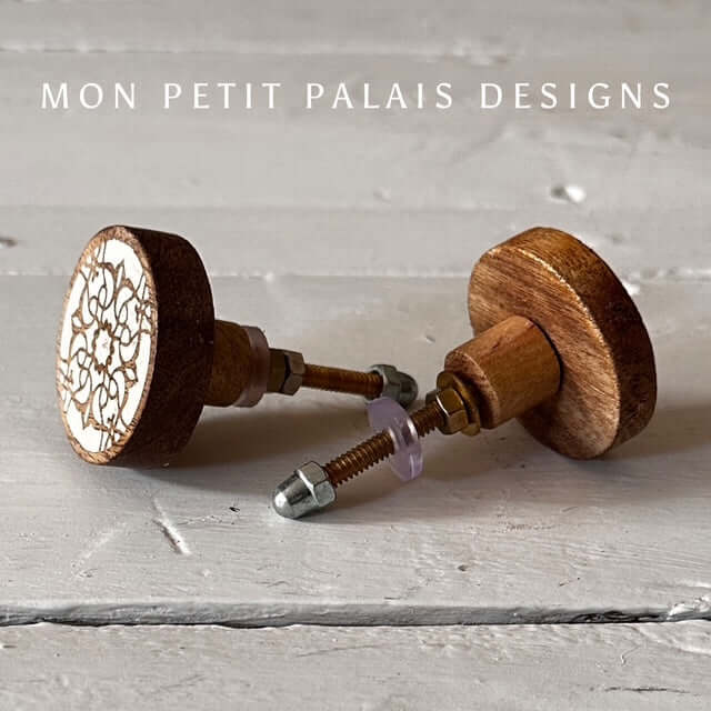 Pair of Zoe carved wood knobs with white mandala-style detail, handcrafted look from Mon Petit Palais Designs - perfect for vintage and boho interiors.
