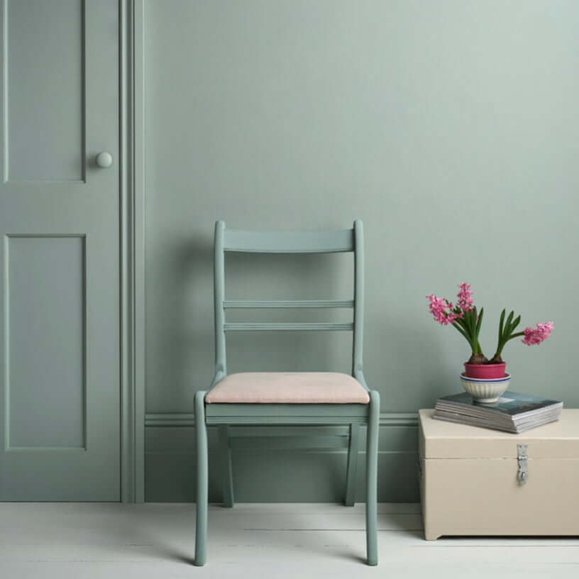 Pemberley Blue - Annie Sloan Satin Paint used on a chair and wall, creating a serene pastel ambiance.