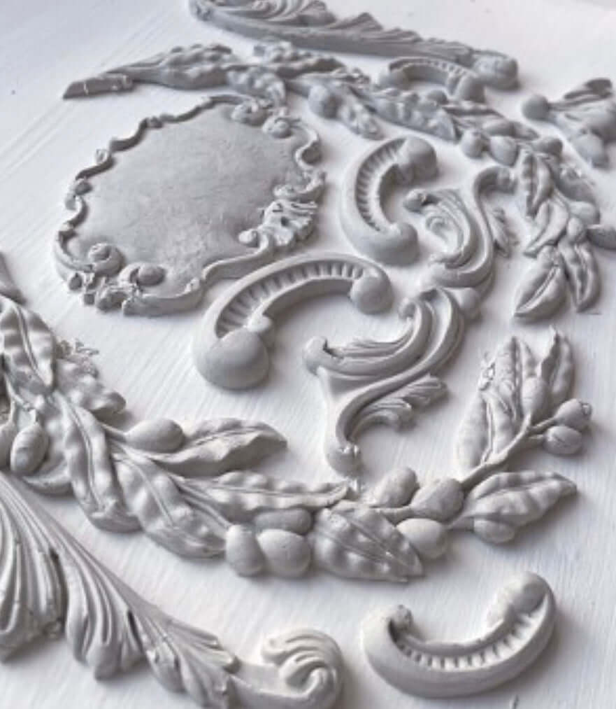 IOD Olive Crest Decor Mould showcasing sculptural olive branches and scrollwork for décor and crafts.