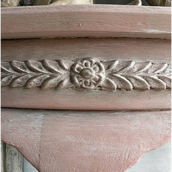 Applique Mouldings for Furniture & Decor Close-up of floral amd leaf applique detail on painted furniture using Annie Sloan Chalk Paint in a vintage distressed finish