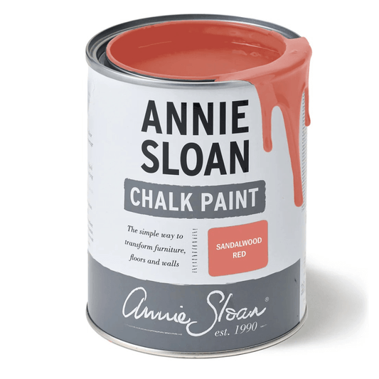 Open tin of Annie Sloan Chalk Paint in Sandalwood Red with warm red paint dripping over the edge.