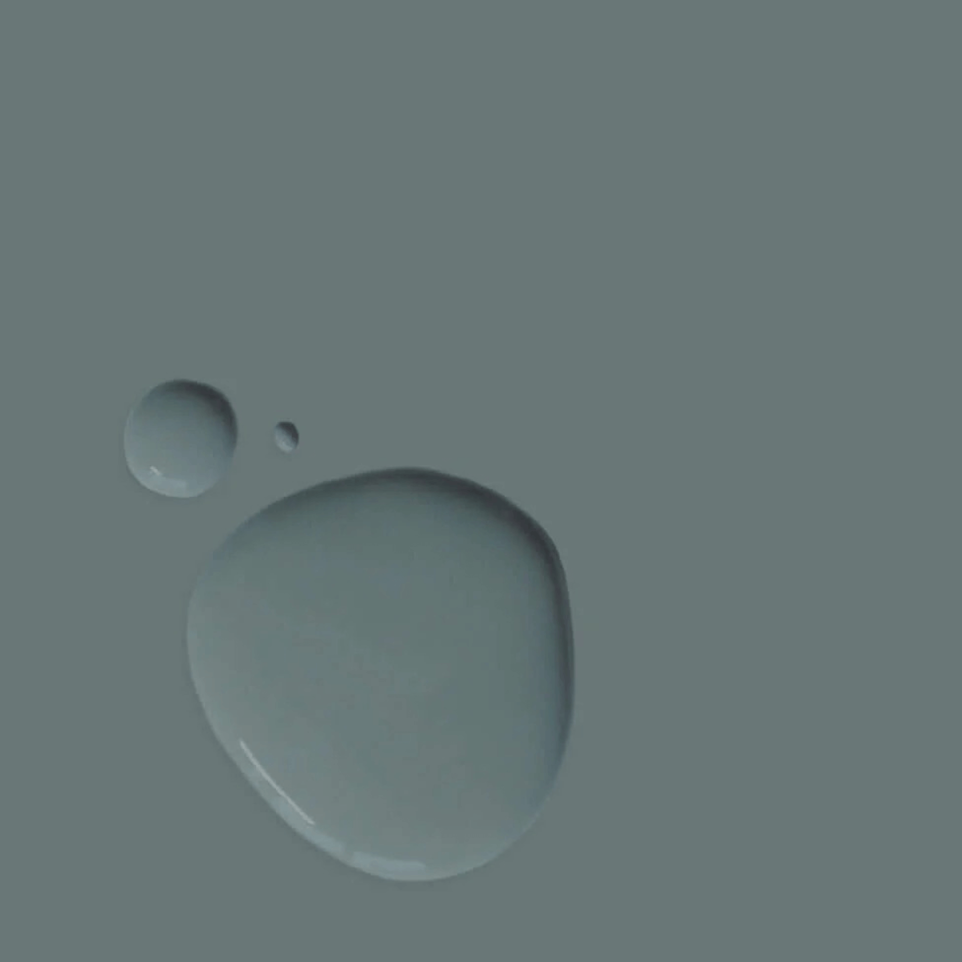 Cambrian Blue - Annie Sloan Satin Paint droplets on a textured surface showcasing its elegant denim color.