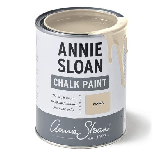Open tin of Annie Sloan Chalk Paint in Canvas with creamy neutral paint dripping over the edge.