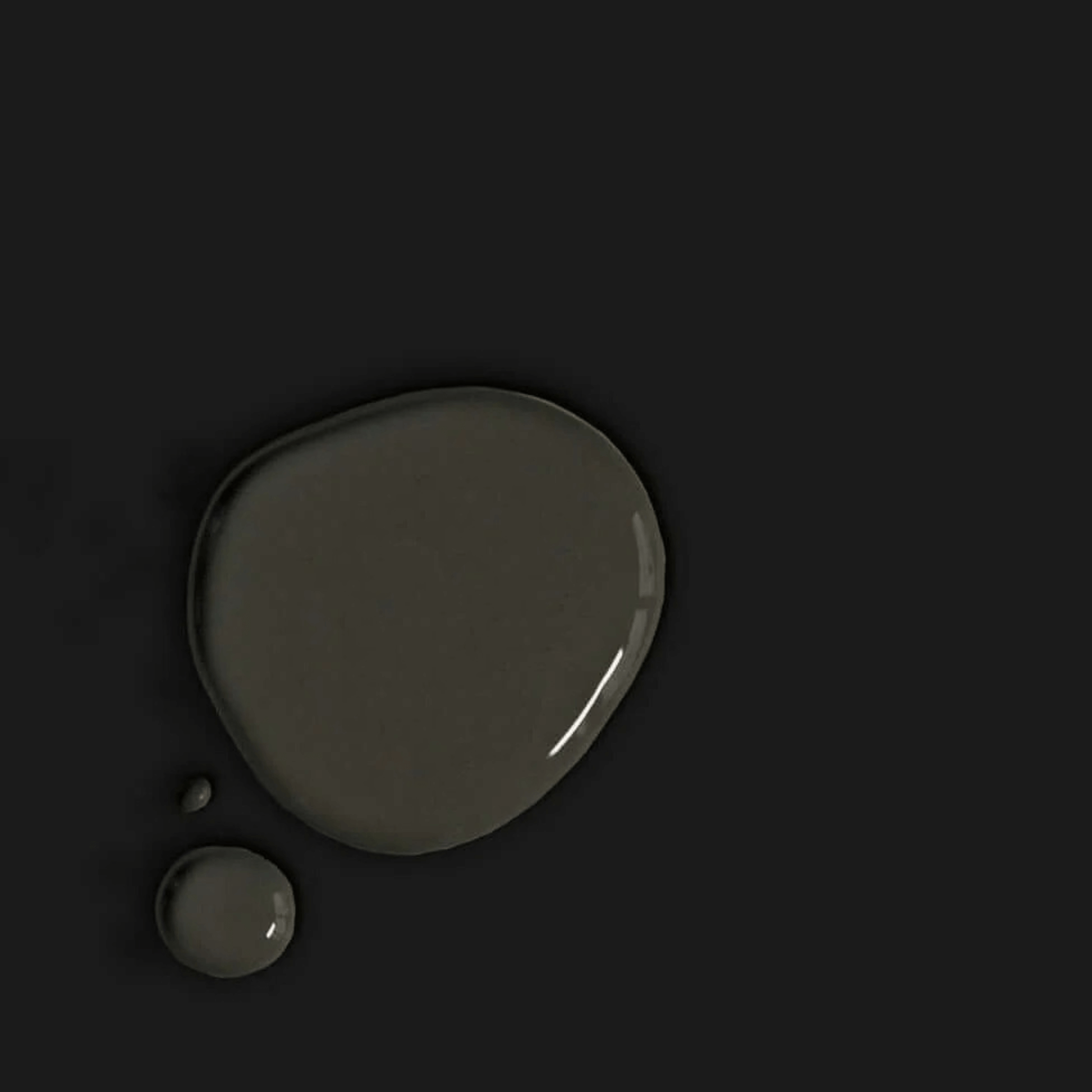 Athenian Black - Annie Sloan Satin Paint shown as a glossy paint drop on a dark surface.