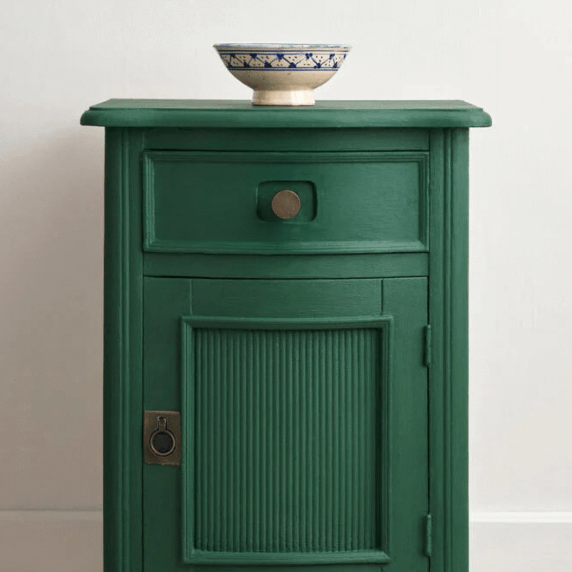 Amsterdam Green - Annie Sloan Chalk Paint used on a stylish green bedside table with decorative bowl.