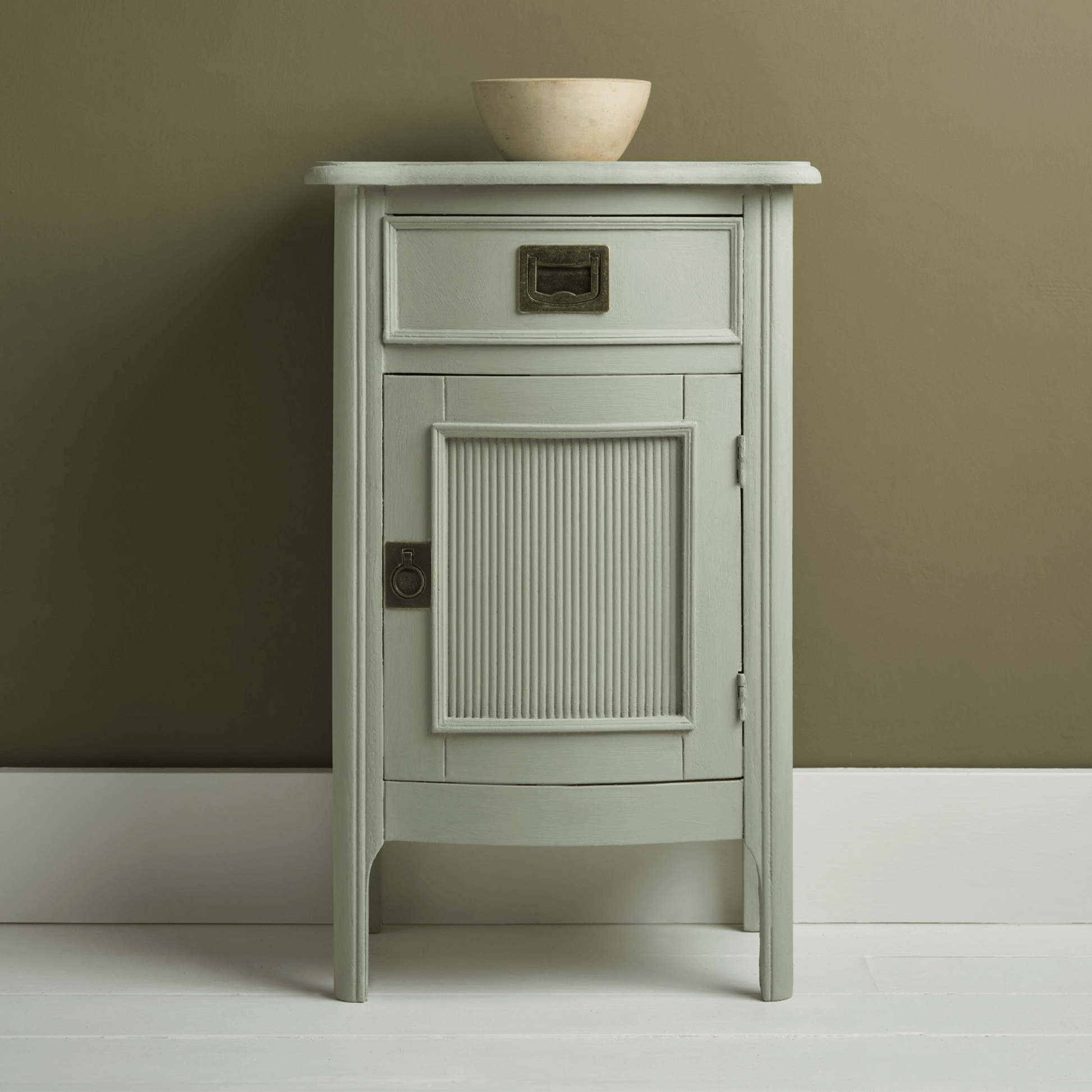 Coolabah Green Annie Sloan Chalk Paint used on a stylish cabinet with a minimalist design.