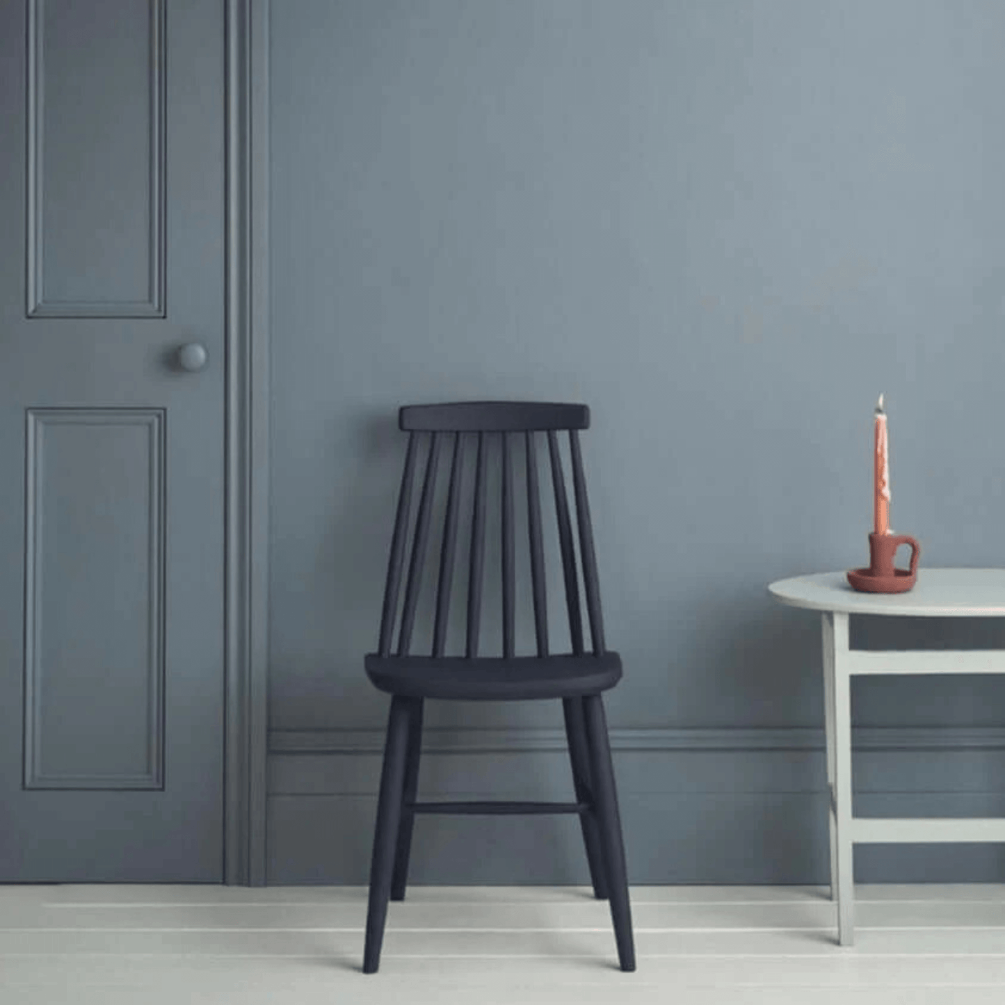 Cambrian Blue - Annie Sloan Satin Paint used on walls with a stylish chair and table in a serene interior setting.