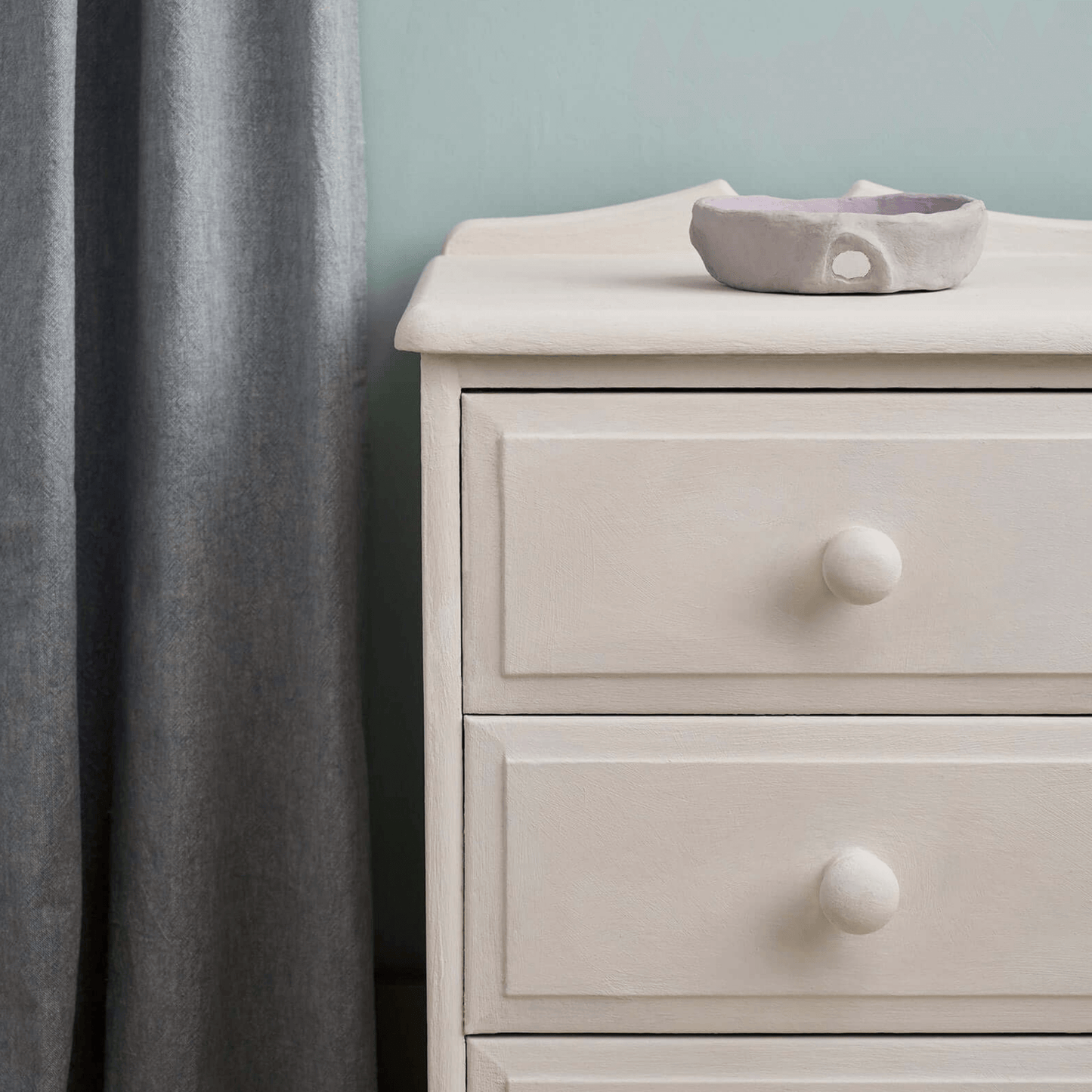 Close-up of Rococo White-painted drawers, highlighting its soft pink-white tone.