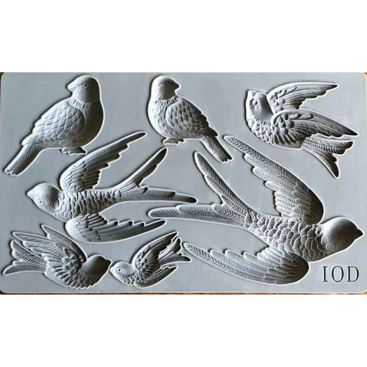 Close-up view of the Birdsong IOD Décor Mould showing intricately detailed bird designs, including perched and flying birds, ideal for crafting furniture appliqués and decor accents.