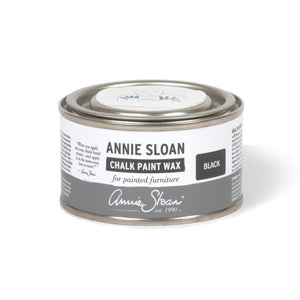 A 500ml tin of Annie Sloan Black Chalk Paint™ Wax, ideal for adding depth, enhancing texture, and protecting painted furniture. The tin features the Annie Sloan logo and a modern design.