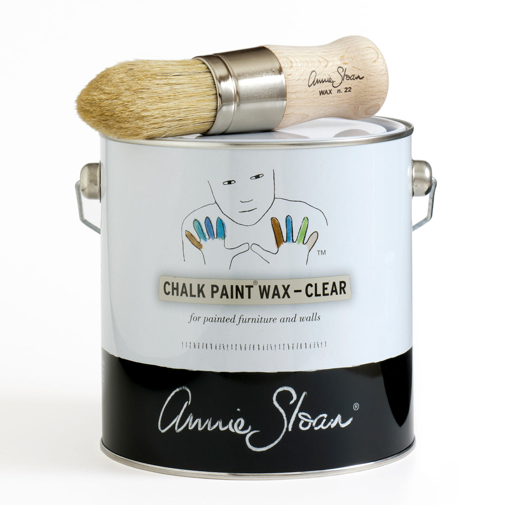 Annie Sloan Chalk Paint Clear wax 2.5L tin with wax brush resting on top, ideal for sealing and protecting painted furniture and walls