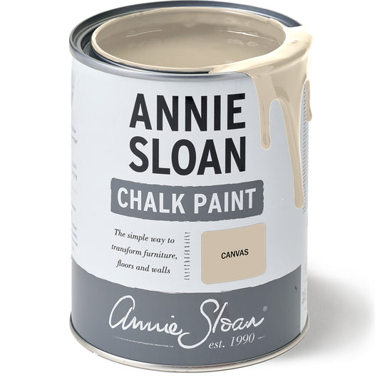 Open tin of Annie Sloan Chalk Paint in Canvas with creamy neutral paint dripping over the edge.