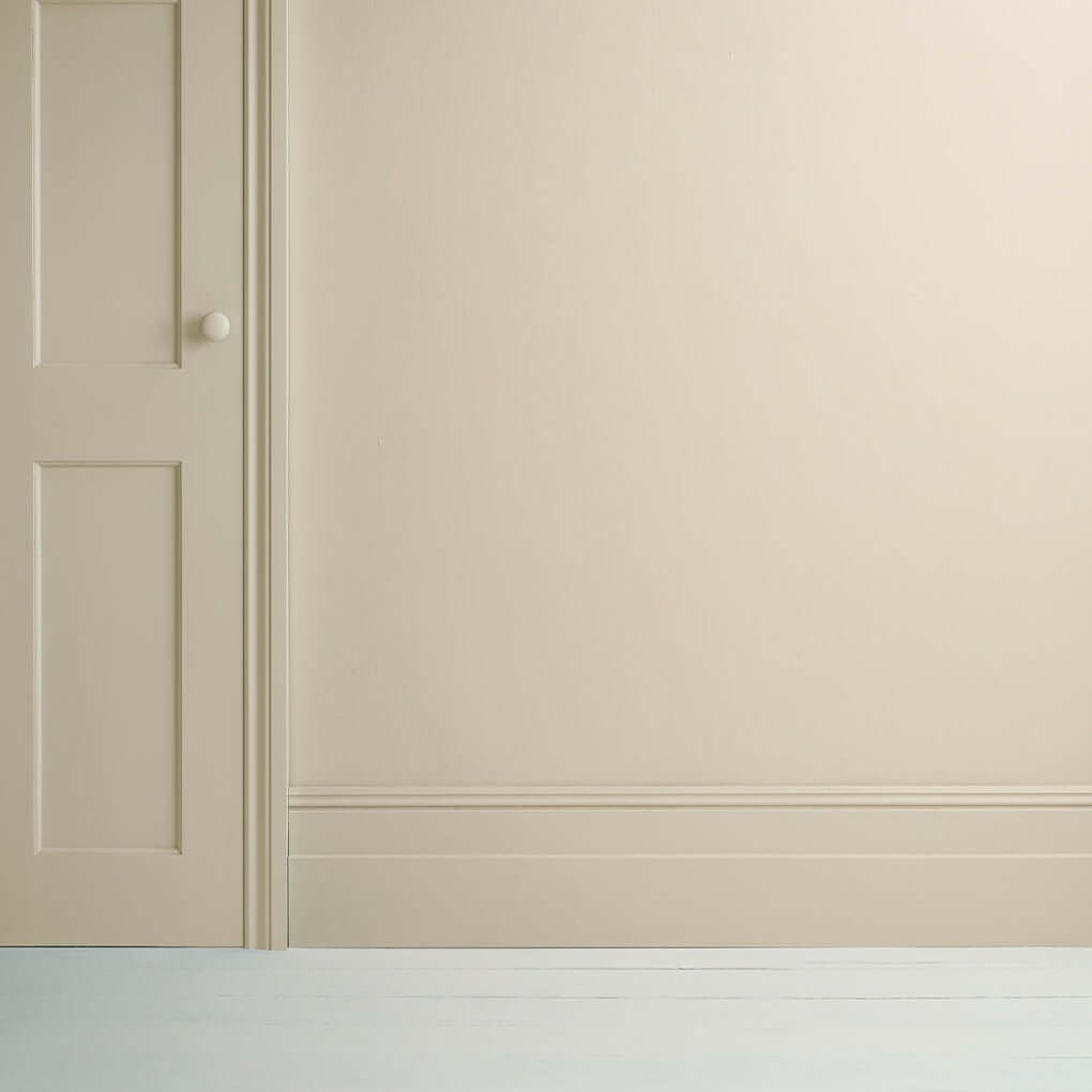Canvas - Annie Sloan Satin Paint applied on a wall and door, showcasing a beautiful beige-white finish.
