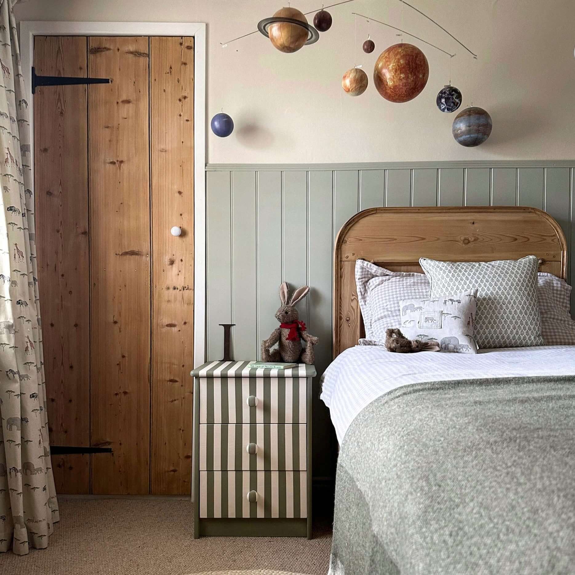 Cotswold Green - Annie Sloan Satin Paint used in a stylish children's bedroom with planet decals on the wall.