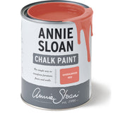 Open tin of Annie Sloan Chalk Paint in Sandalwood Red with warm red paint dripping over the edge.