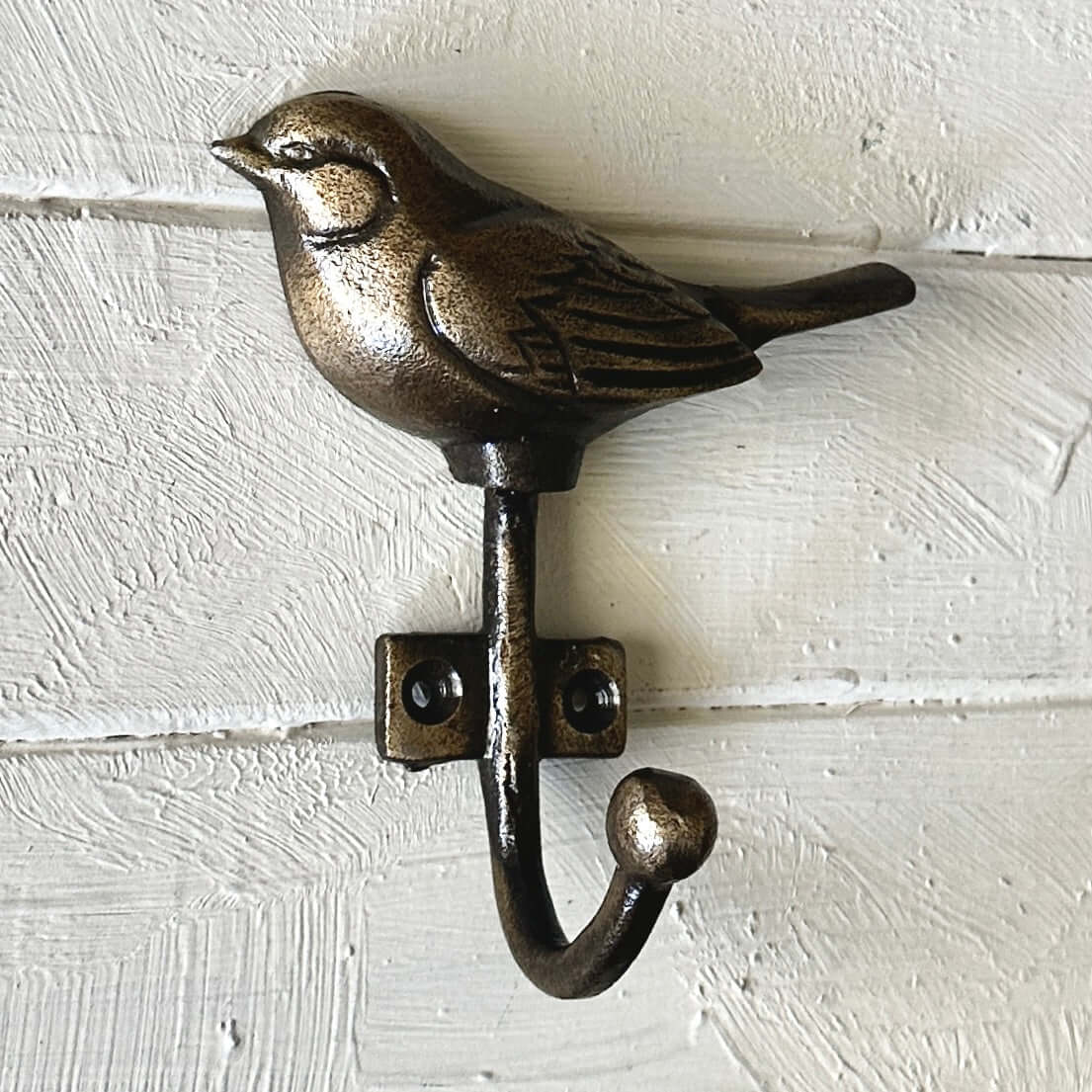 Bronze Bird Wall Hook featuring a detailed bird sculpture for decorative and functional wall decor.