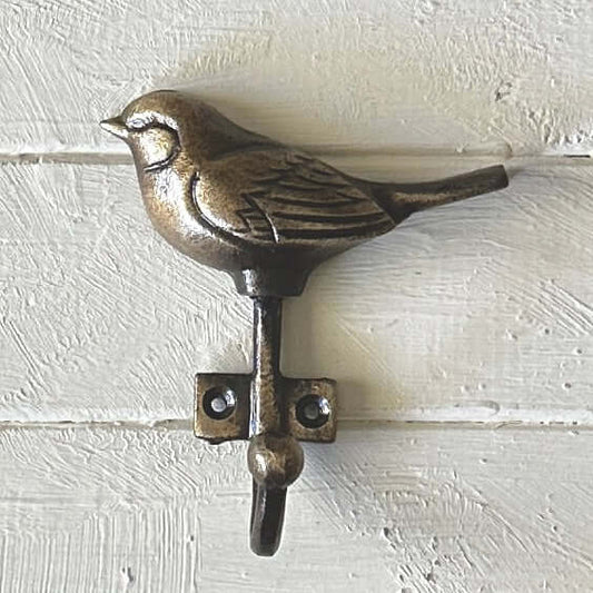 Bronze Bird Wall Hook showcasing detailed design on a wooden background, ideal for home decor and organizing accessories.