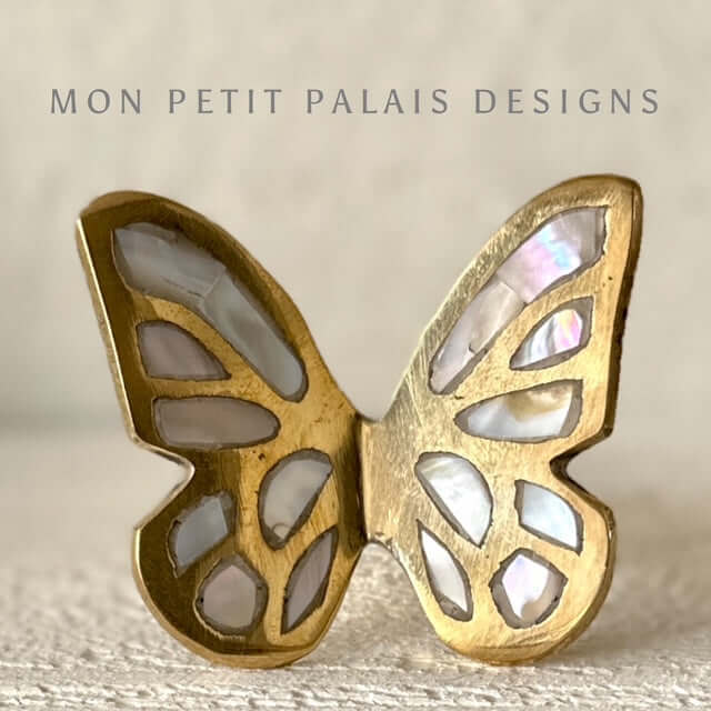 Butterfly brass cabinet knob with mother of pearl inlay. front view - decorative knob for drawers, cabinets, and furniture upgrades.