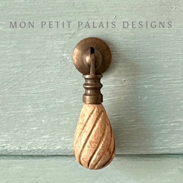 Front view of Elodie drop pull showing spiral carved wood and classic brass fixture - Mon Petit Palais Designs.
