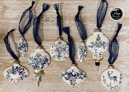 IOD Bibelots Decor Mould vintage ornament blanks for holiday crafts, featuring charming designs and navy ribbons.