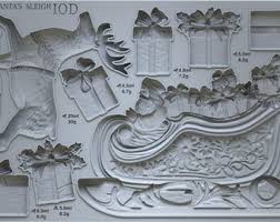 IOD Santa’s Sleigh Decor Mould showcasing Santa's sleigh, reindeer, and gift boxes for vintage Christmas crafts.