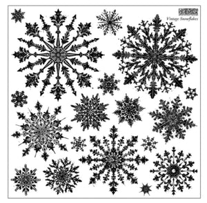 Close-up of the IOD Vintage Snowflakes Stamp, showing a collection of detailed vintage-style snowflake designs in black, arranged across a 12" x 12" sheet.