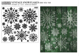 Full product image of the IOD Vintage Snowflakes Stamp, featuring intricately detailed snowflake designs in various sizes, with a single 12" x 12" sheet layout, perfect for holiday crafting