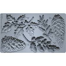 IOD Winter Forage Decor Mould™ showcasing intricately designed botanical elements like leaves and pinecones.
