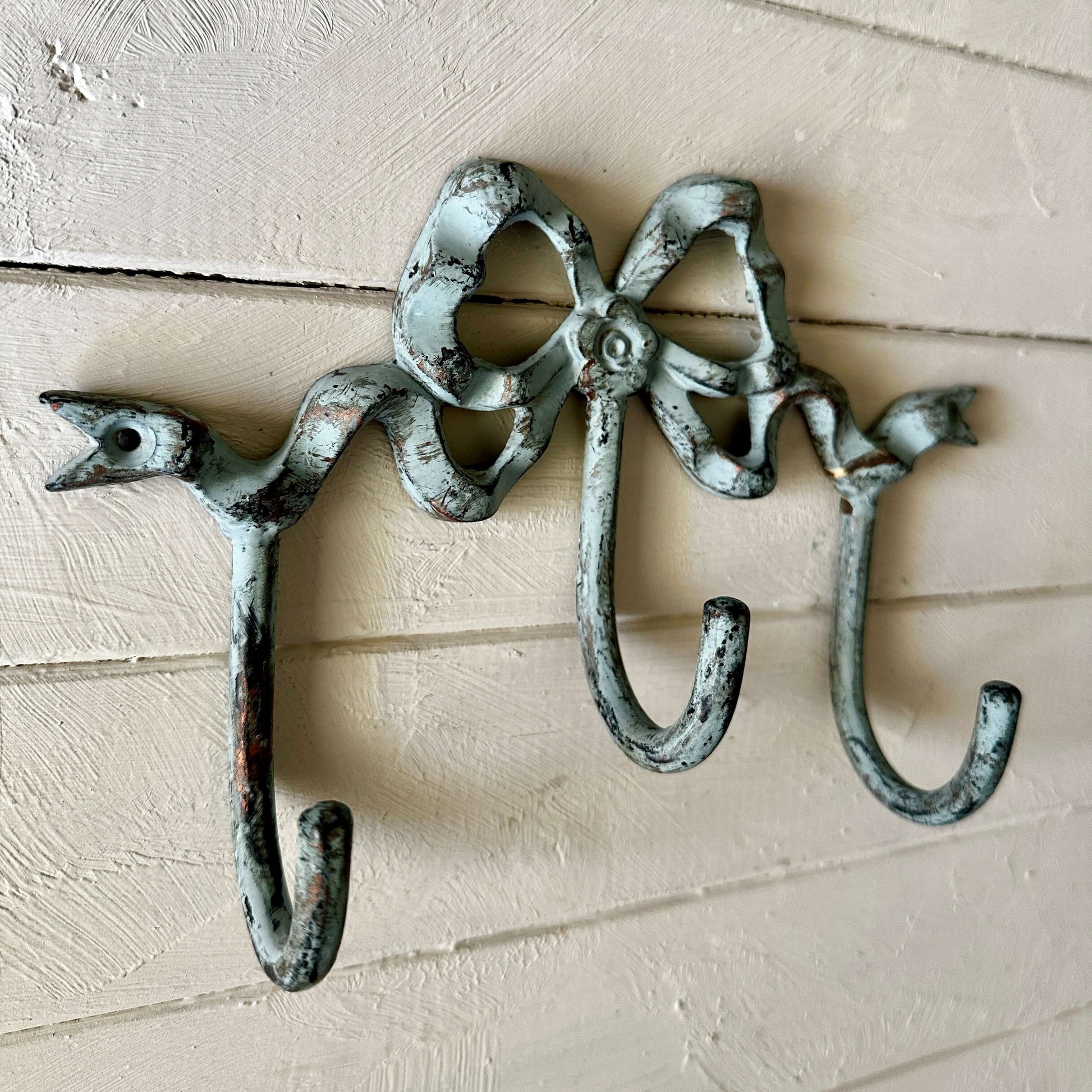 Teale Bow Wall Hook – Vintage Coastal-Style Metal Triple Hook with bird details and aged Teale finish.