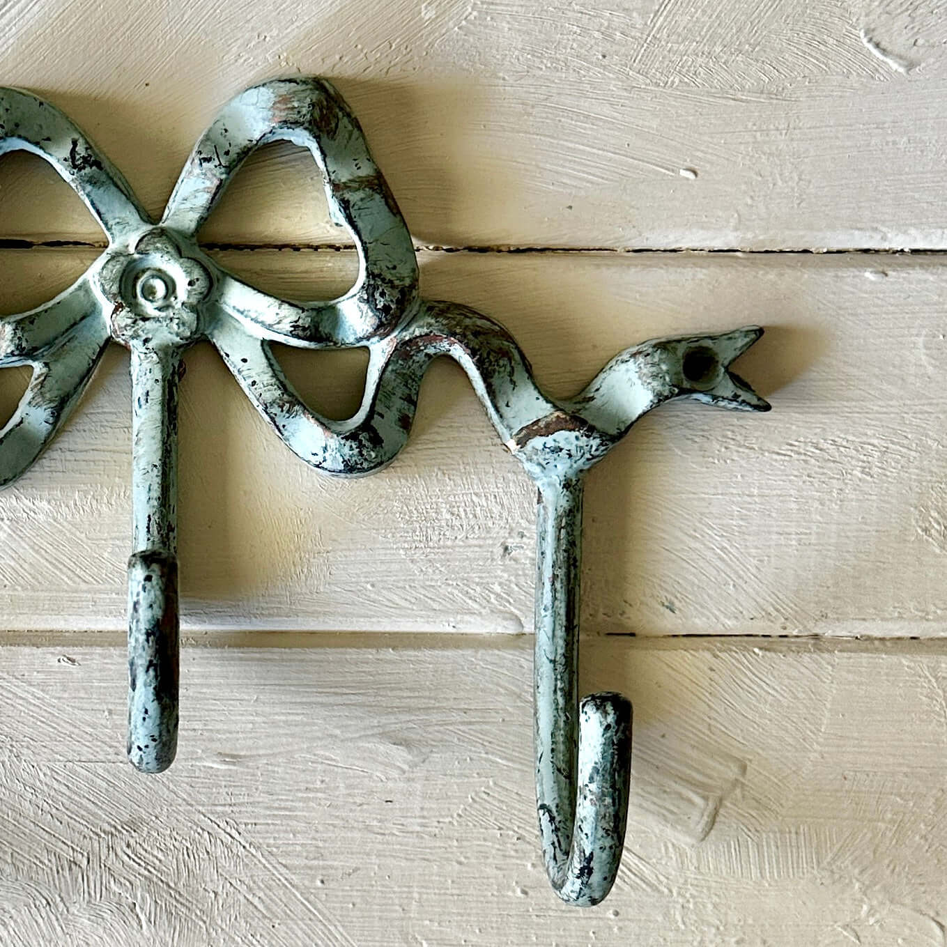Teale Bow Wall Hook in vintage coastal style with bird details and aged finish, perfect for adding charm to any space.