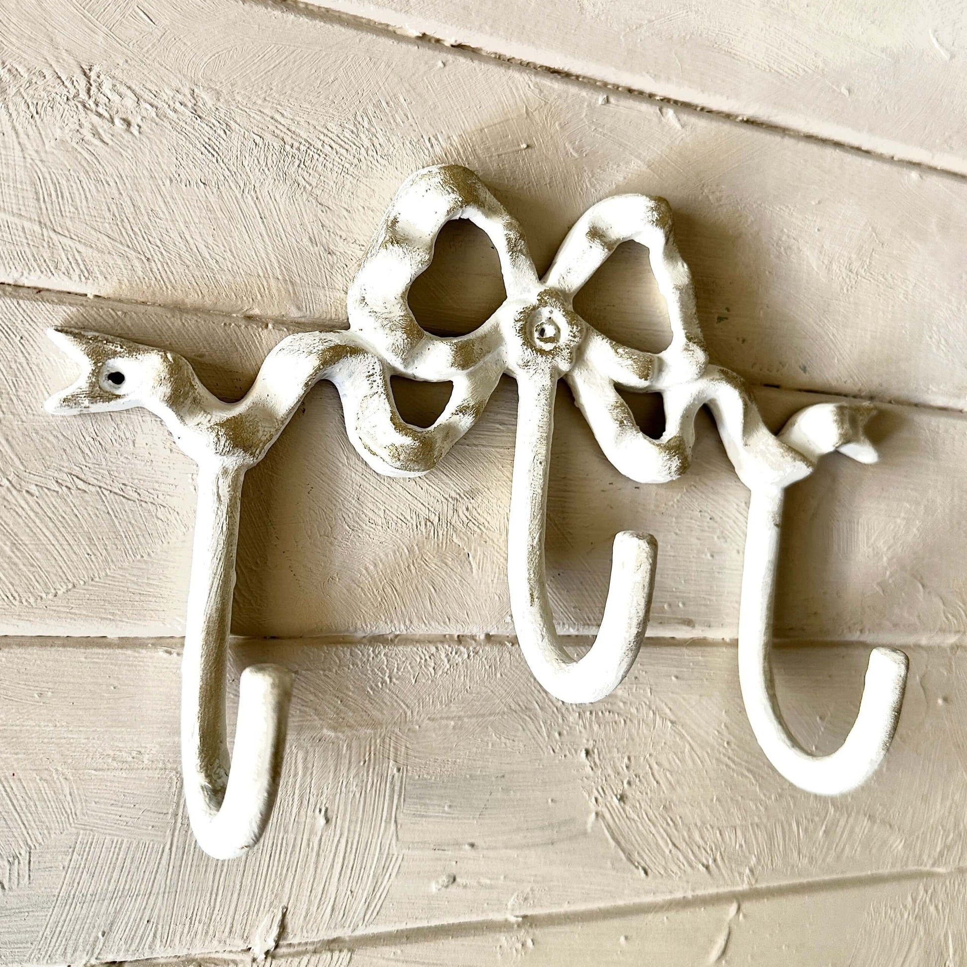 White Bow Wall Hook with three hooks, featuring a vintage style and elegant bow design for decorative wall storage.