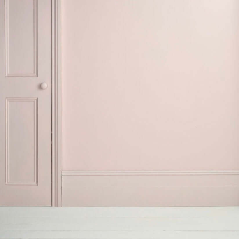 Pointe Silk - Annie Sloan Satin Paint applied on a wall and door, showcasing a soft, cool-toned pink finish.