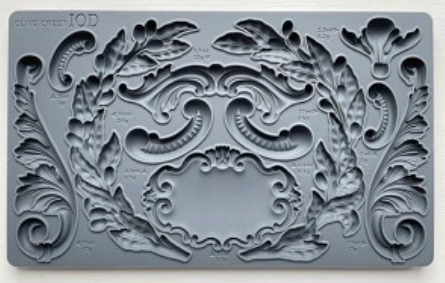 Close-up of the Olive Crest IOD Décor Mould showcasing detailed olive branches, scrolls, and crest designs for DIY crafts, furniture accents, and home décor.