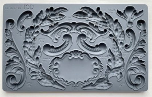 Close-up of the Olive Crest IOD Décor Mould showcasing detailed olive branches, scrolls, and crest designs for DIY crafts, furniture accents, and home décor.